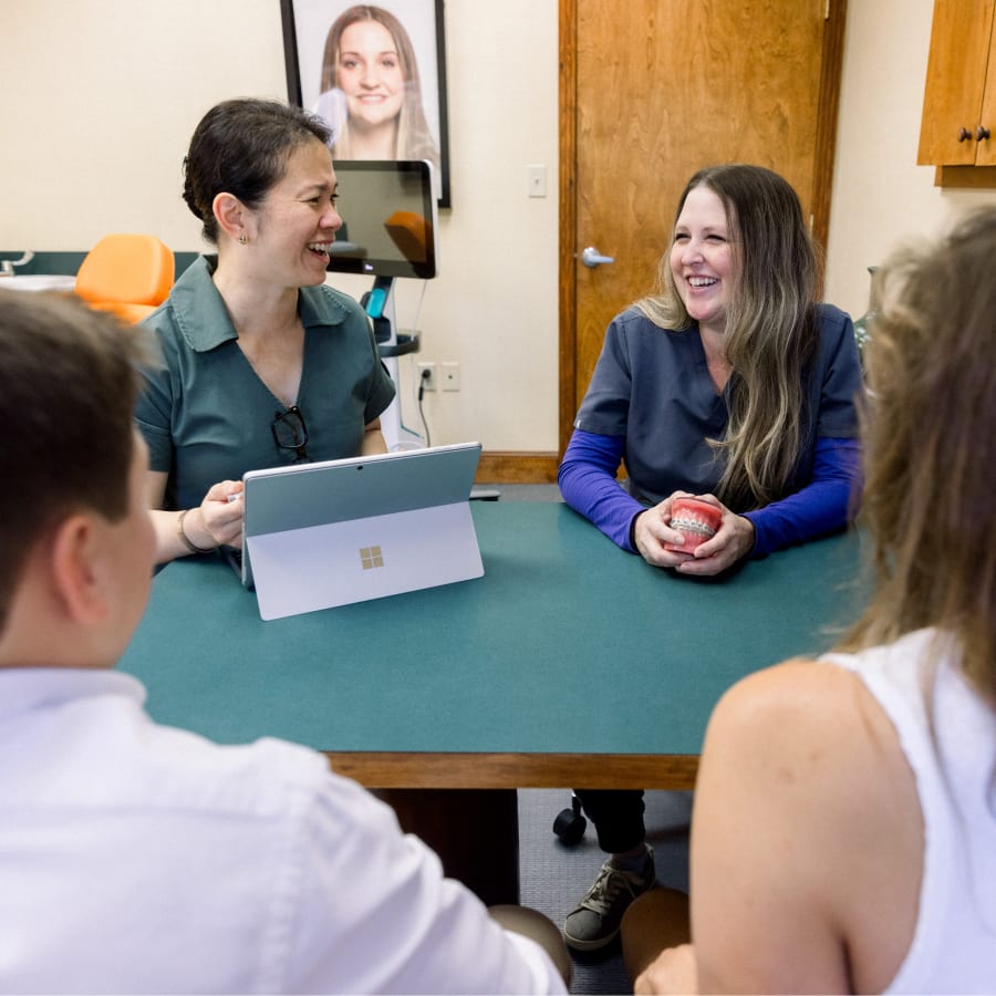 Dr. Diane and her colleague are laughing with a patient.